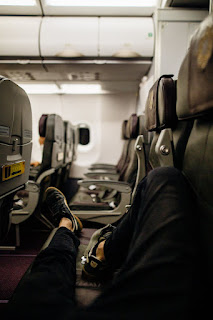Lower body stretches on an airplane Illustration of leg and ankle stretches that can be done discreetly in an airplane seat.