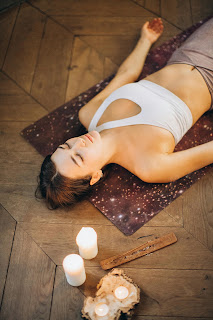 Close-up of hands in Anjali Mudra at the heart center, symbolizing gratitude and the Anusara principle of opening to grace