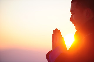 peaceful morning meditation ritual in a serene environment, illustrating a person seated in a meditation pose on a mountain, surrounded by early morning light. This image captures the essence of starting the day with mindfulness meditation, showcasing a tranquil setting that encourages relaxation and focus