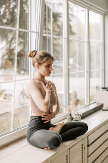 A person practicing mindful breathing to achieve relaxation and stress relief. This image illustrates the technique of mindful breathing, showing a person seated in a calm, meditative pose focusing on their breath. Ideal for understanding the foundational practice of mindfulness meditation