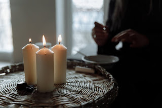 A meditation practitioner preparing their space for a group meditation focused on love, and healing.