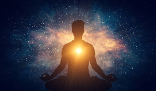 Silhouette of a person meditating with a radiant glow emanating from their heart, symbolizing the expansive awareness and boundless consciousness experienced in the formless Jhanas.