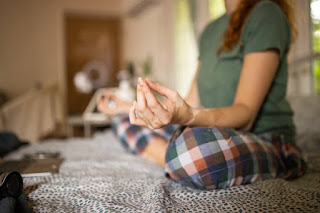 Hands in Vishnu Mudra during Nadi Shodhana to promote balance and relaxation before sleep.