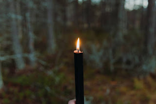 Close-up of a candle flame, representing the transformative energy of the fire element in meditation.