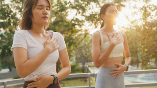 Person practicing a heart-opening yoga pose, symbolizing alignment and motivation for New Year’s goals.