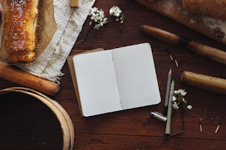 Open journal with a pen, ready for goal setting and reflections.