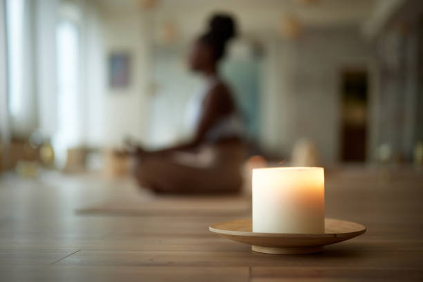 Mediation space with a candle, journal for mediation prompts and autumn decor for seasonal clarity.