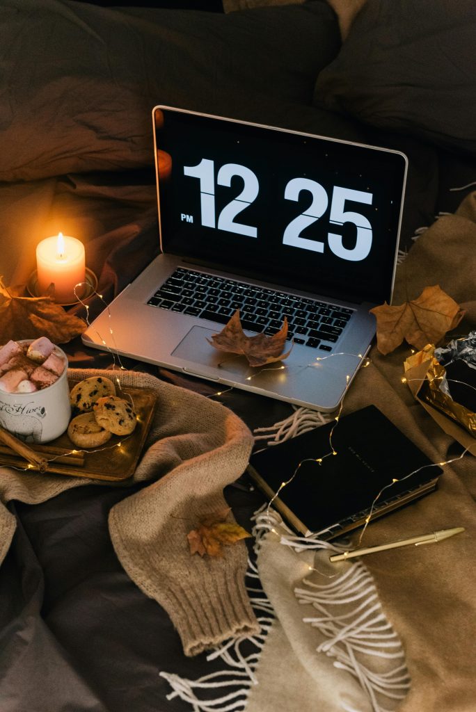 Journal, planner, and cozy props like tea and blankets, reflecting personalized yoga routines for morning birds and evening owls.