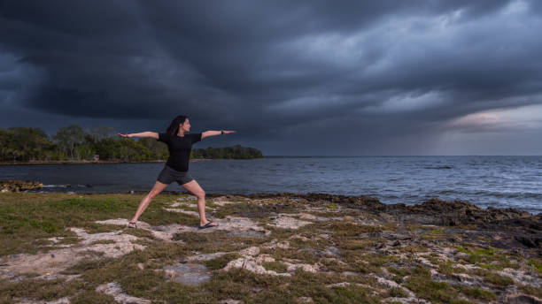 Warrior II pose supporting confidence and balance when working with empty houses in astrology