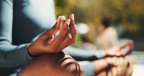 Woman practicing Gyan Mudra during meditation for energy activation